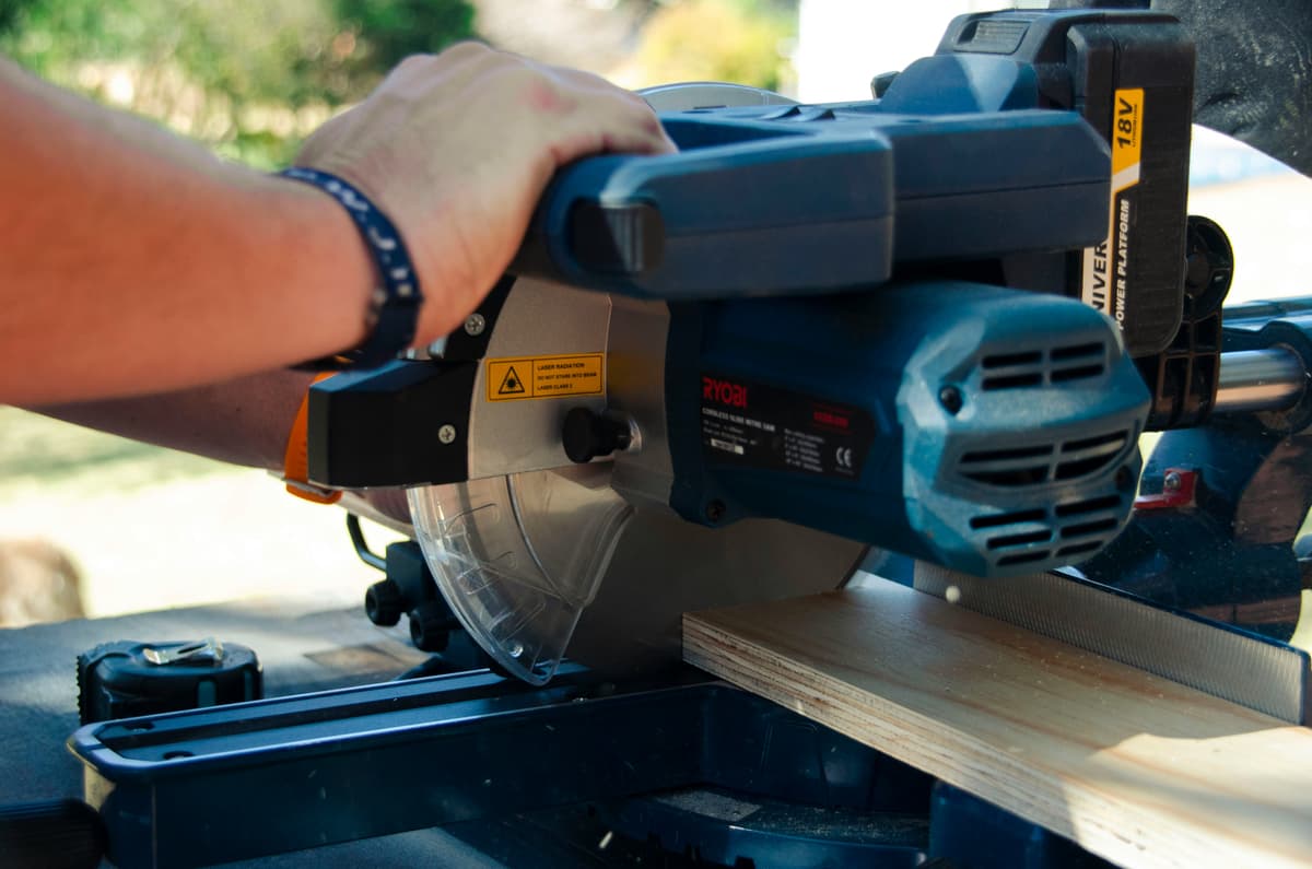 Woodworker cutting wood with a circular saw